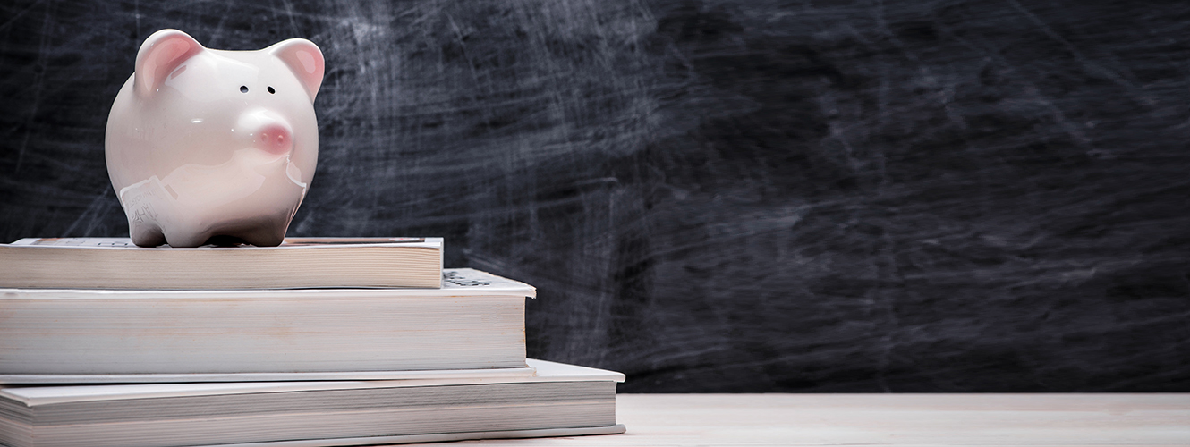 Piggy Bank on top of books